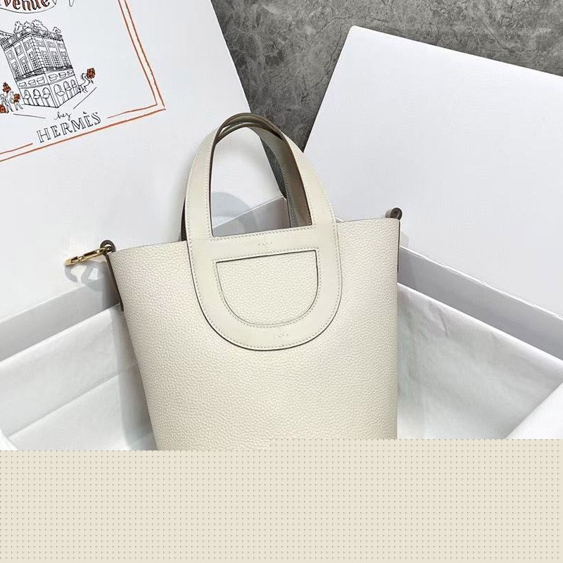 H**mes shopping bags